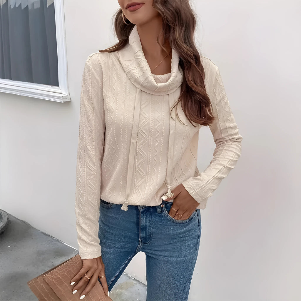Apricot coloured long sleeve hooded pullover sweater with a drawstring.