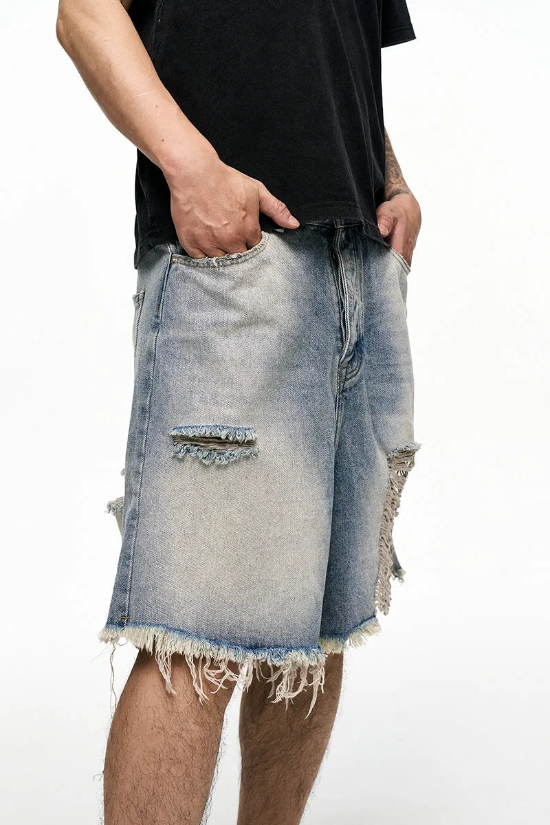 Light blue men's baggy denim shorts with wide leg and zipper fly