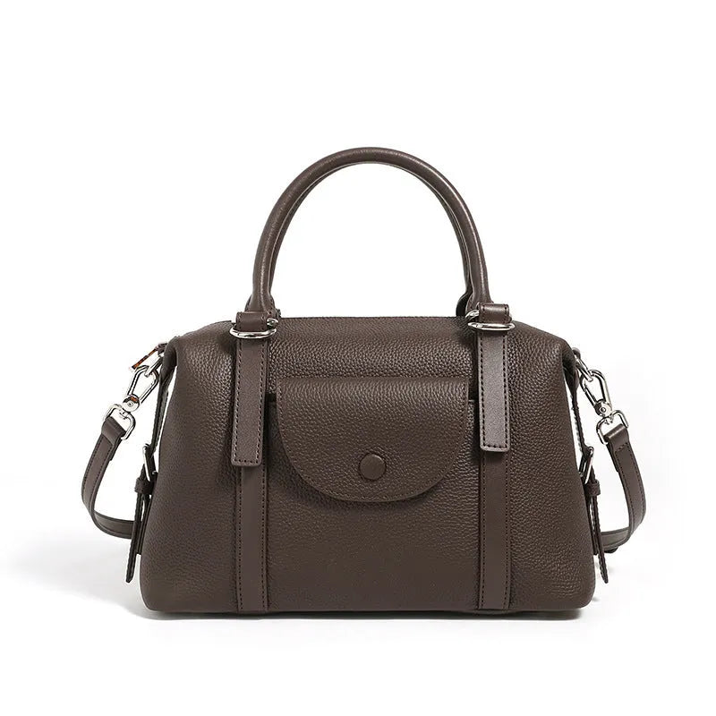 Genuine leather street style handbag for women with adjustable shoulder strap.