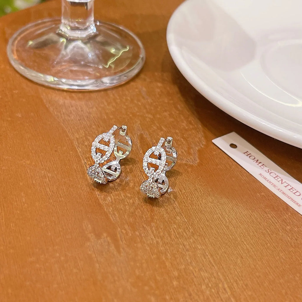 A pair of casual ladies' diamond-effect earrings with thick gold electroplating.