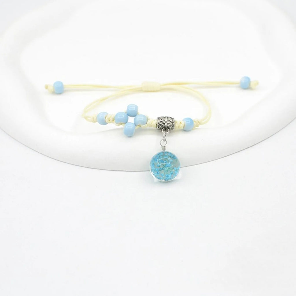 Glass dried flower bracelet for women with large 1.4cm bead and lace charm in multiple colour choices.