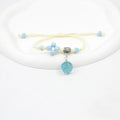 Glass dried flower bracelet for women with large 1.4cm bead and lace charm in multiple colour choices.