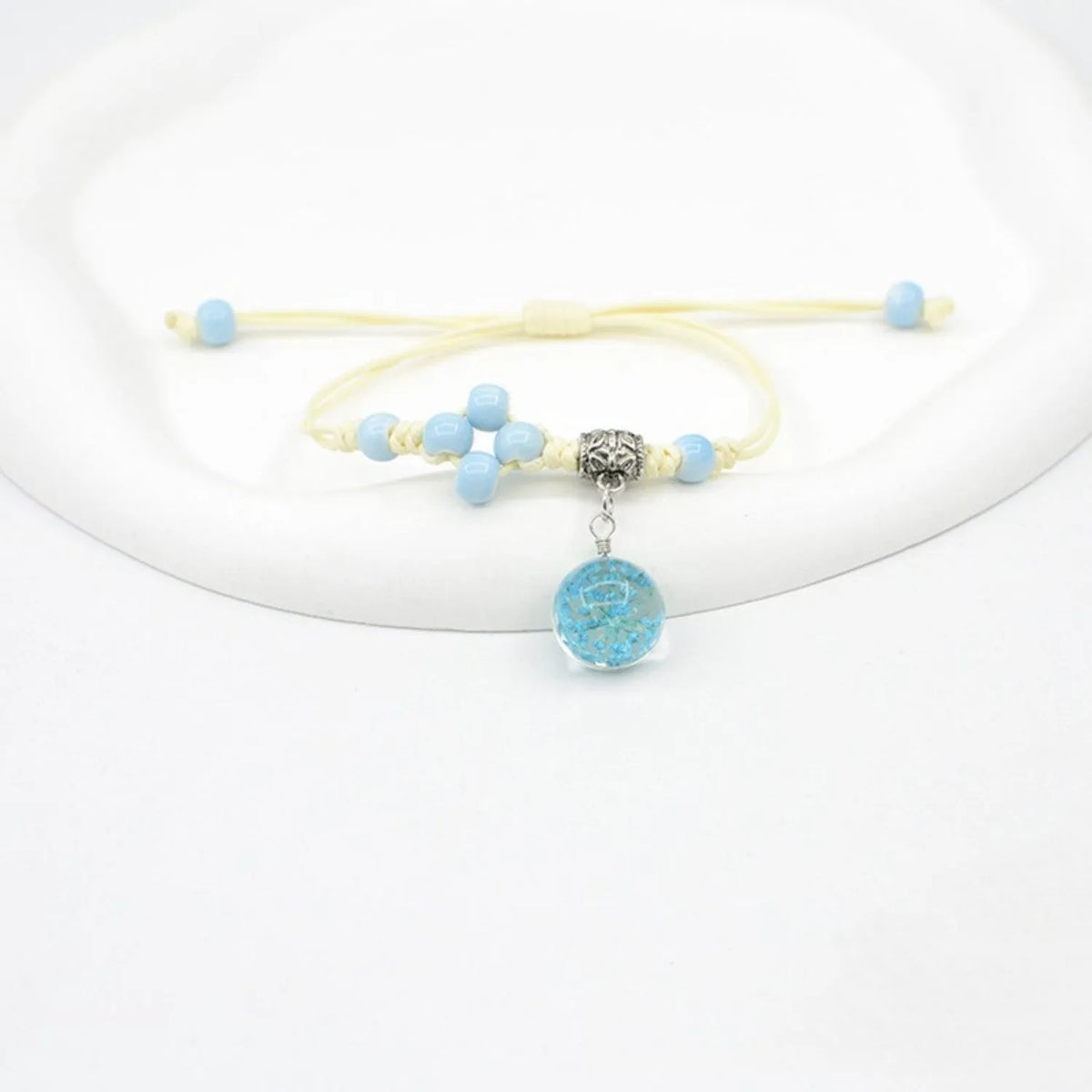 Glass dried flower bracelet for women with large 1.4cm bead and lace charm in multiple colour choices.