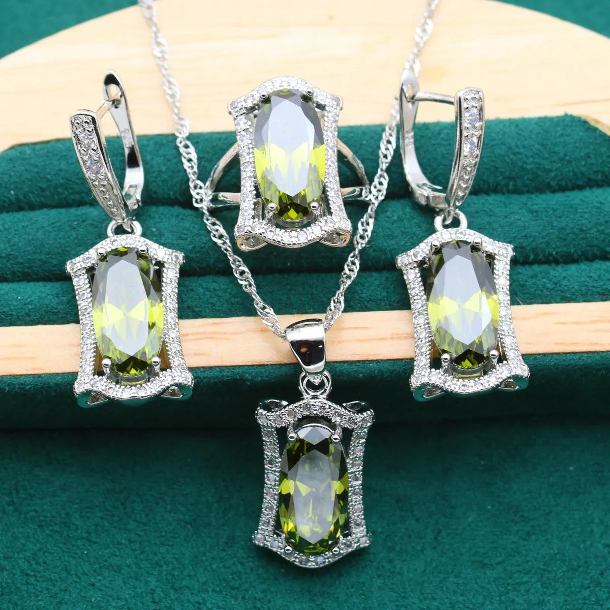 Women's zircon dinner jewellery set with necklace, bracelet, earrings, and ring in yellow or olive green colours