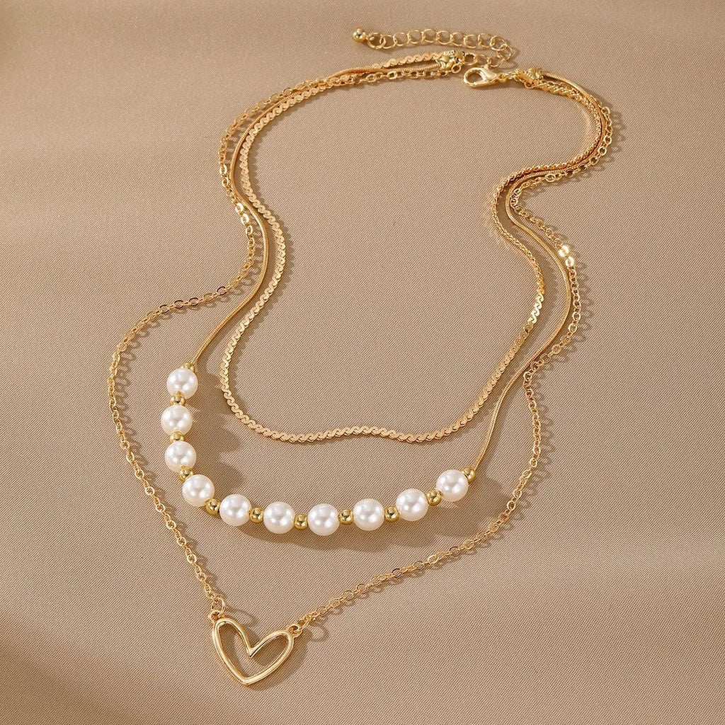 Vintage gold electroplated heart pendant necklace with adjustable pearl chain
