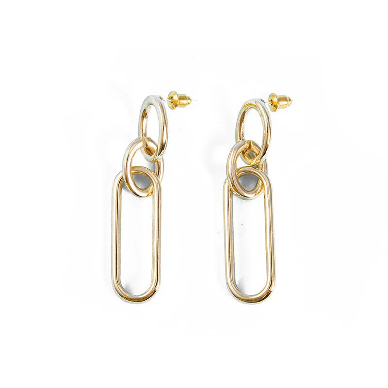 Geometric sterling silver coloured alloy hoop earrings for women with a ring and line design.