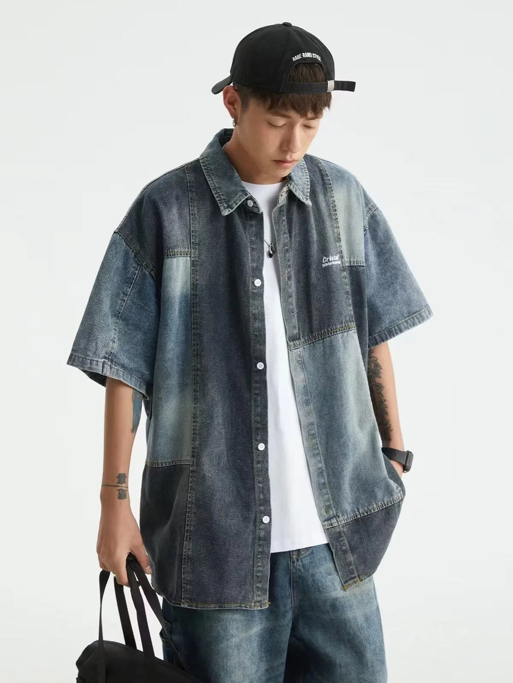 Blue loose-fit men's denim shirt with Japanese retro washed stitching detail.