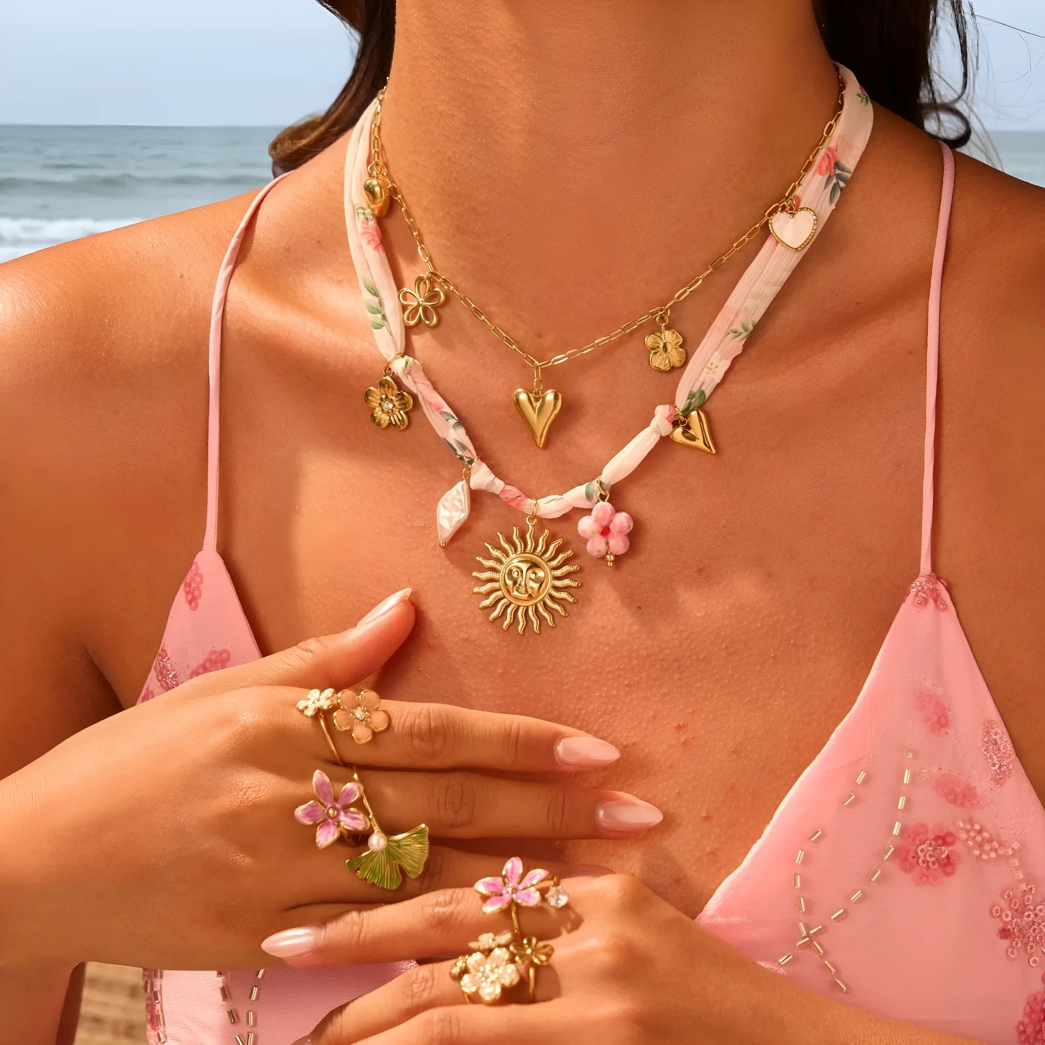 Stainless steel necklace with geometric sun pendant on an adjustable chain.