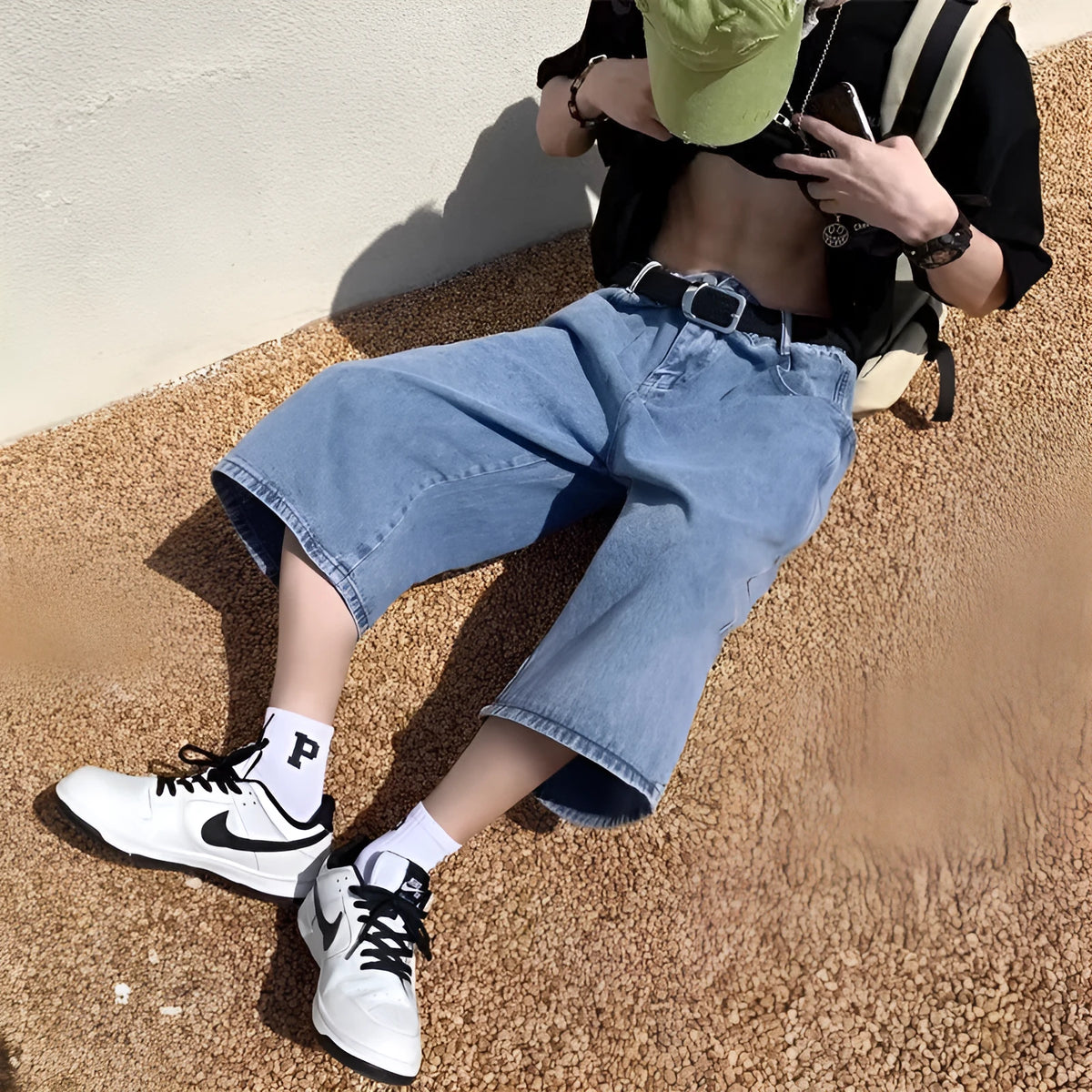 Blue washed denim men's pirate shorts with a high waist and straight legs on a white background.