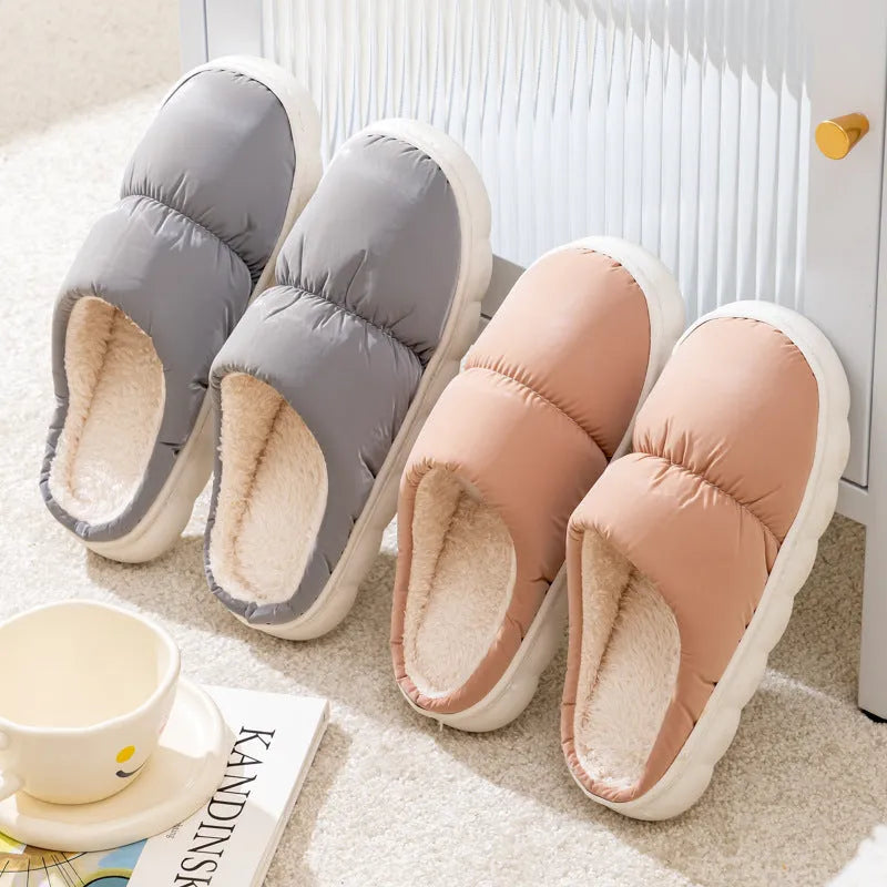 A pair of thick-soled plush slippers with artificial leather uppers and non-slip rubber soles in a choice of five colours.