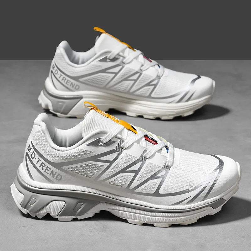 Men's and women's low-top hiking shoes in khaki colour with round toe and lace-up front.