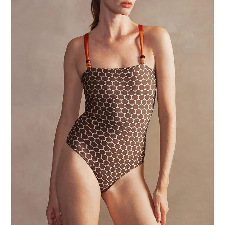 Dot printed one-piece swimsuit with matching wrap skirt in polyester fabric