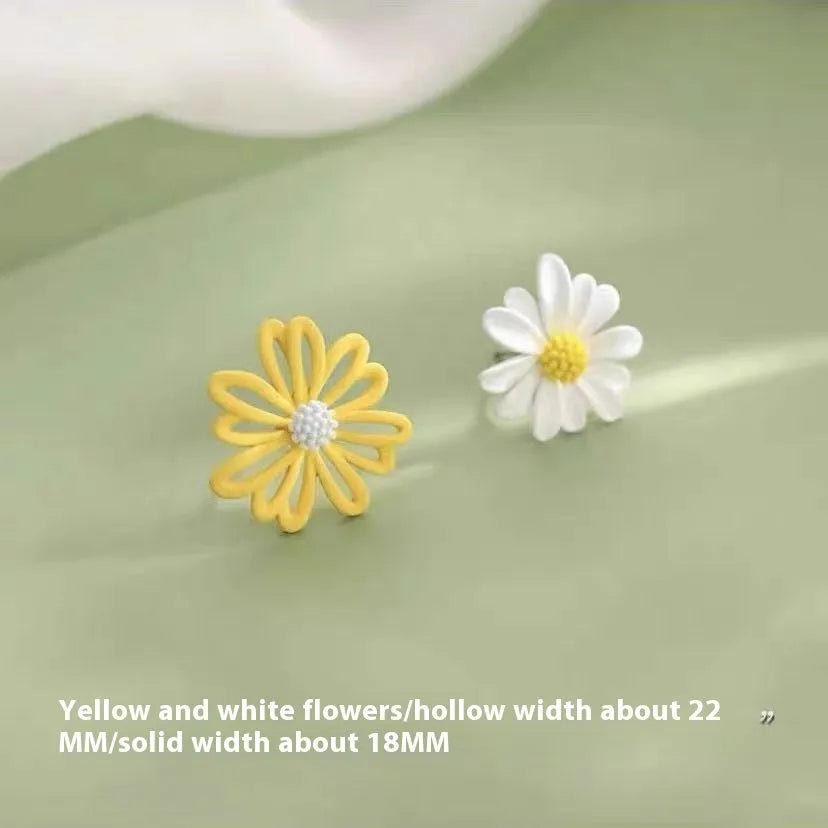 Close-up of colourful alloy flower stud earrings in cartoon style on a white background.