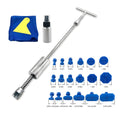 Automotive dent repair tool kit with T-shaped hammer, blue adhesive sticks, and accessories for car body panel restoration
