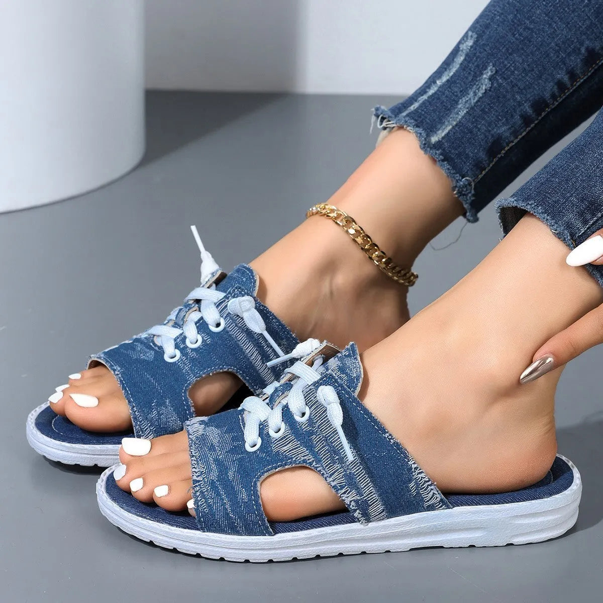 Blue canvas flat slippers for women with rubber soles and Roman-style slip-on design