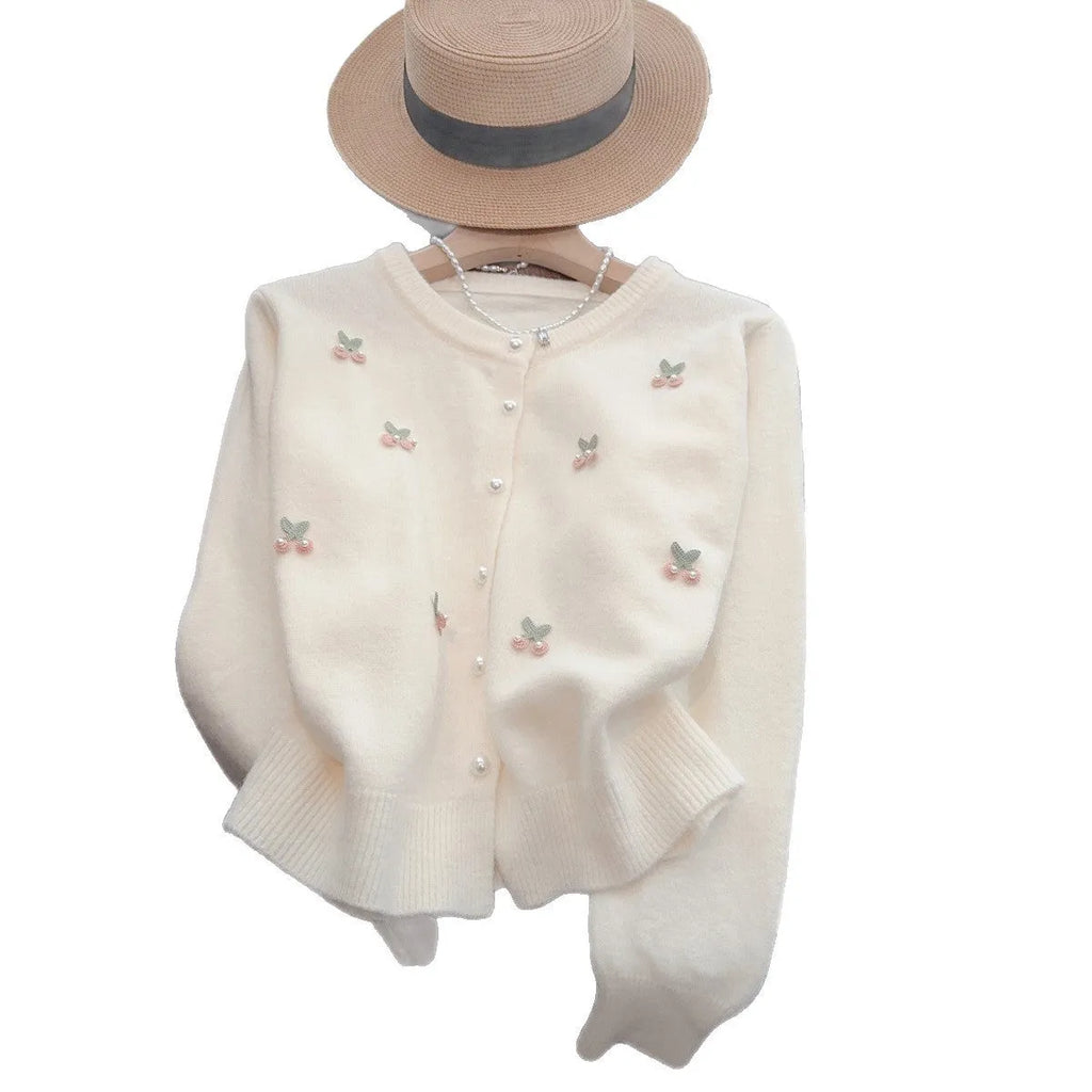 Slim fit cashmere cardigan with beaded detailing in pink, shown open as a layer.