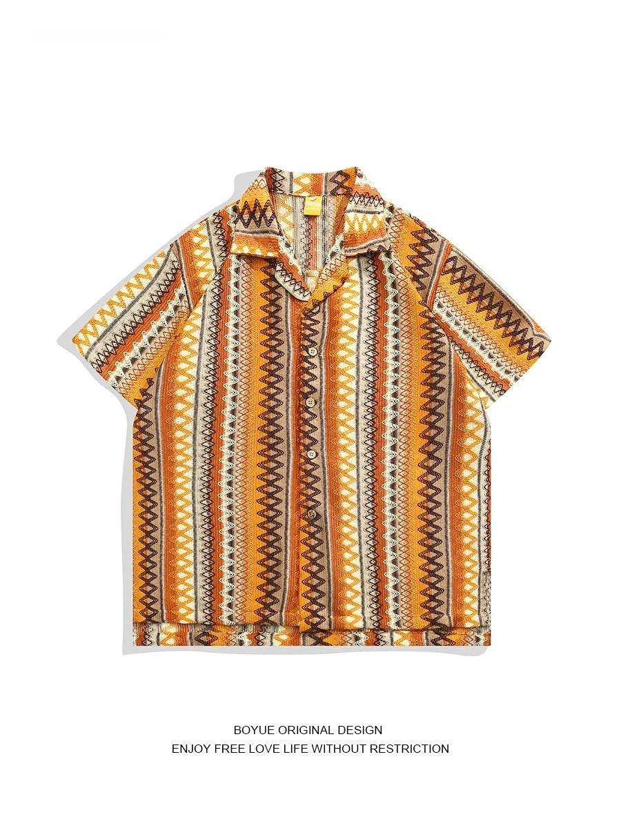 Man modelling a light-coloured ethnic patterned Cuban collar shirt with contrast colours and drop shoulders