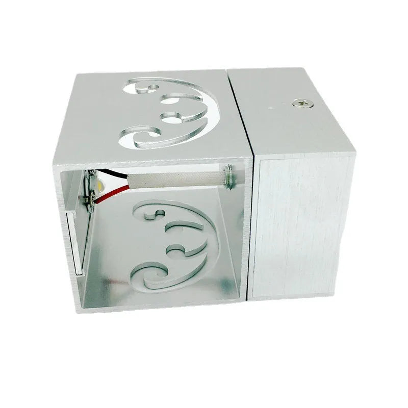 Modern aluminium butterfly-shaped LED wall lamp with remote control for changing light colours.