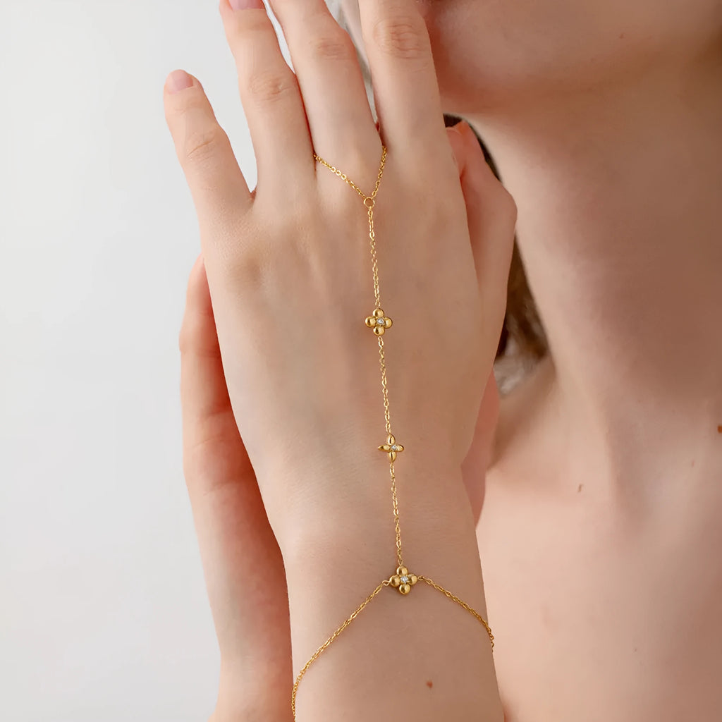 Women's gold stainless steel bracelet with geometric flower and eight-pointed star design