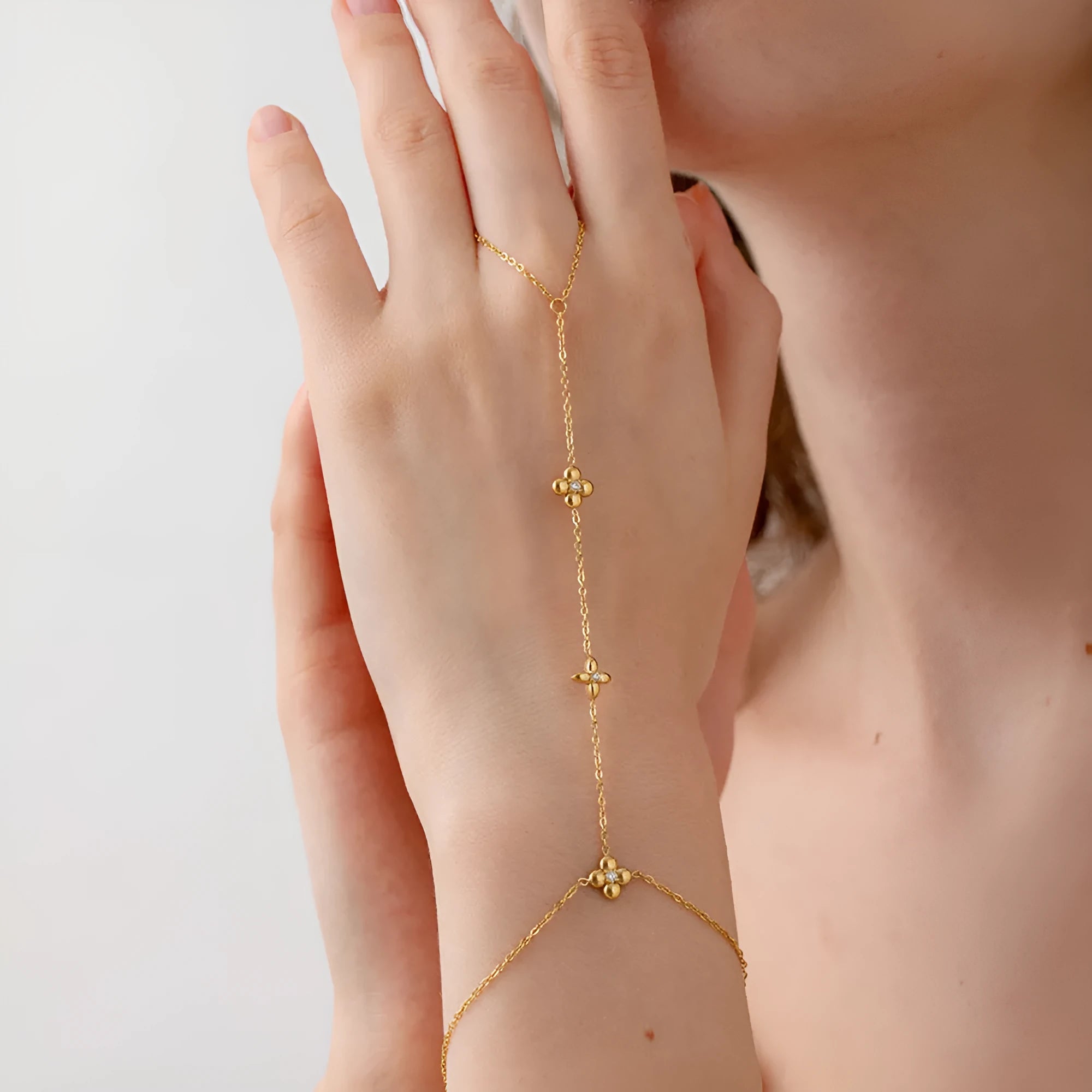 Women's gold stainless steel bracelet with geometric flower and eight-pointed star design