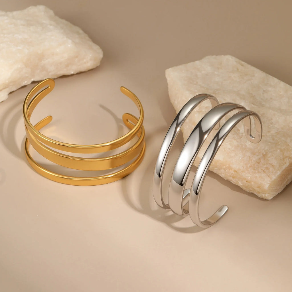Geometric line stainless steel bracelet for women in gold tone or steel finish.