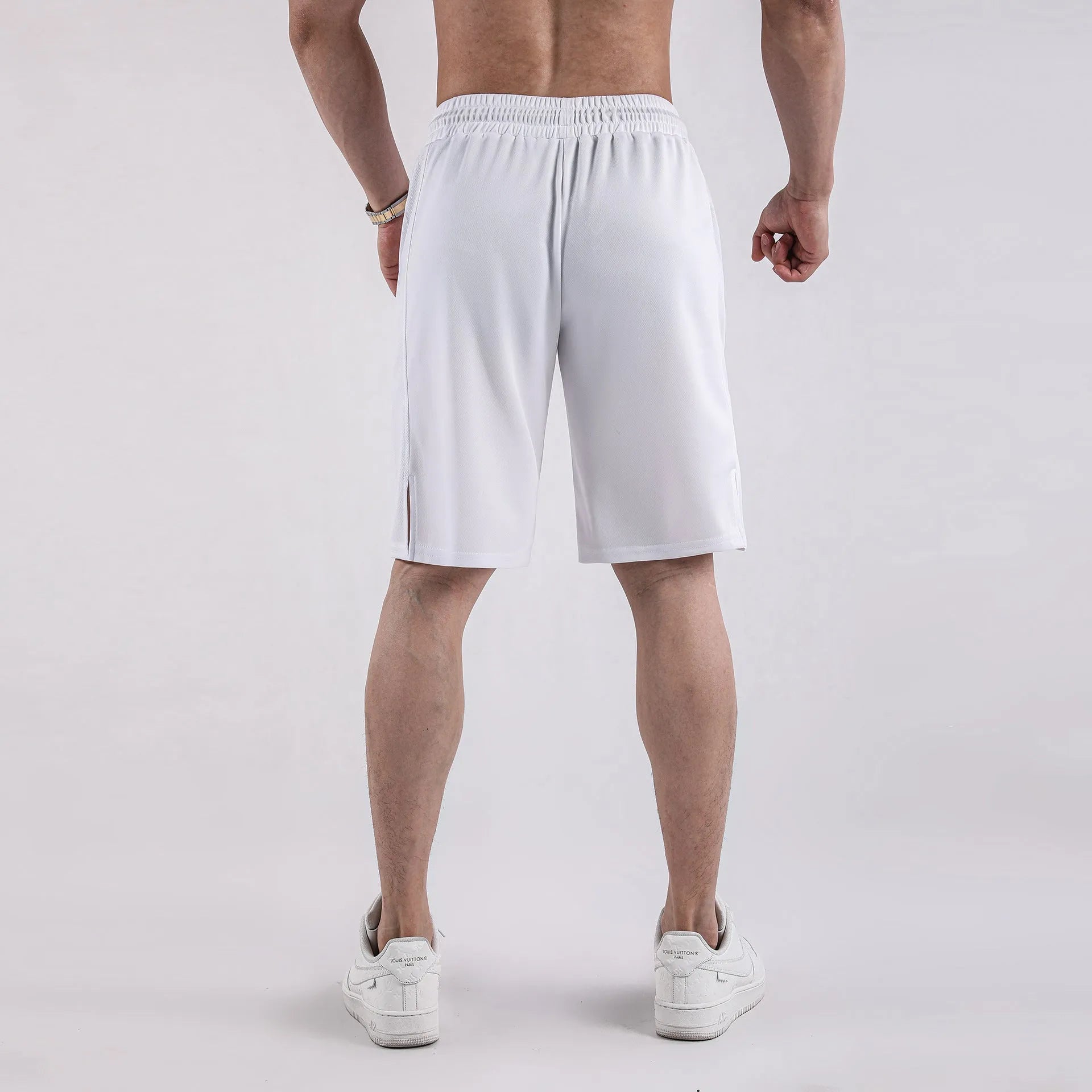 Men's black quick-drying mesh casual shorts with elastic waistband on a neutral background