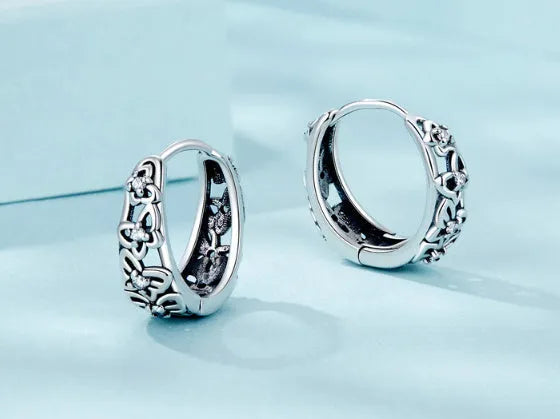 Sterling silver hollow butterfly earrings with zircon accents and retro animal modelling design