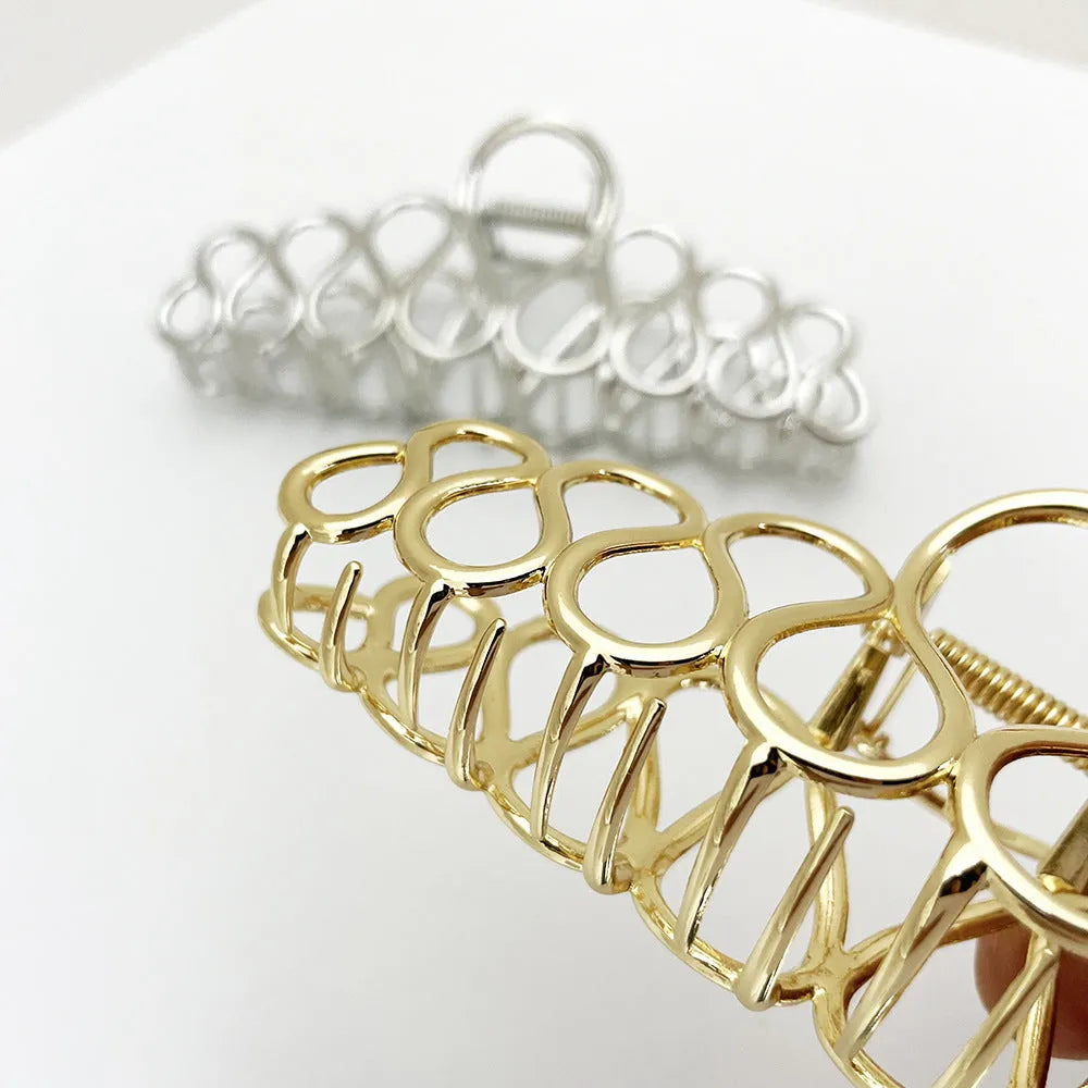 Large minimalist hair clip in gold or silver with tassel detail for updo styling