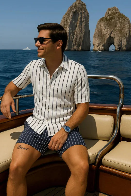 Men's light blue elastic beach shirt and shorts matching set laid flat