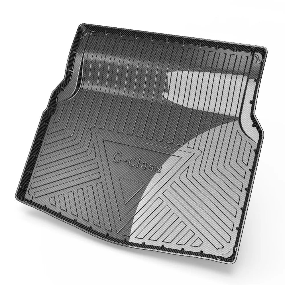 Black TPE car boot liner with a carbon fibre texture pattern laid flat.