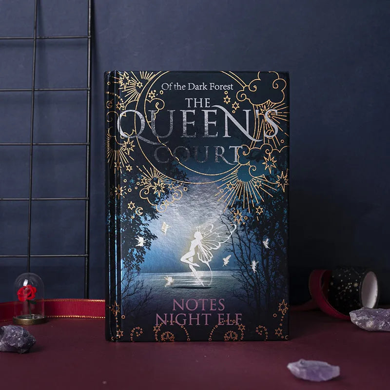 Blue and purple A5 luminous hardcover notebooks open to show full-colour illustrated pages.