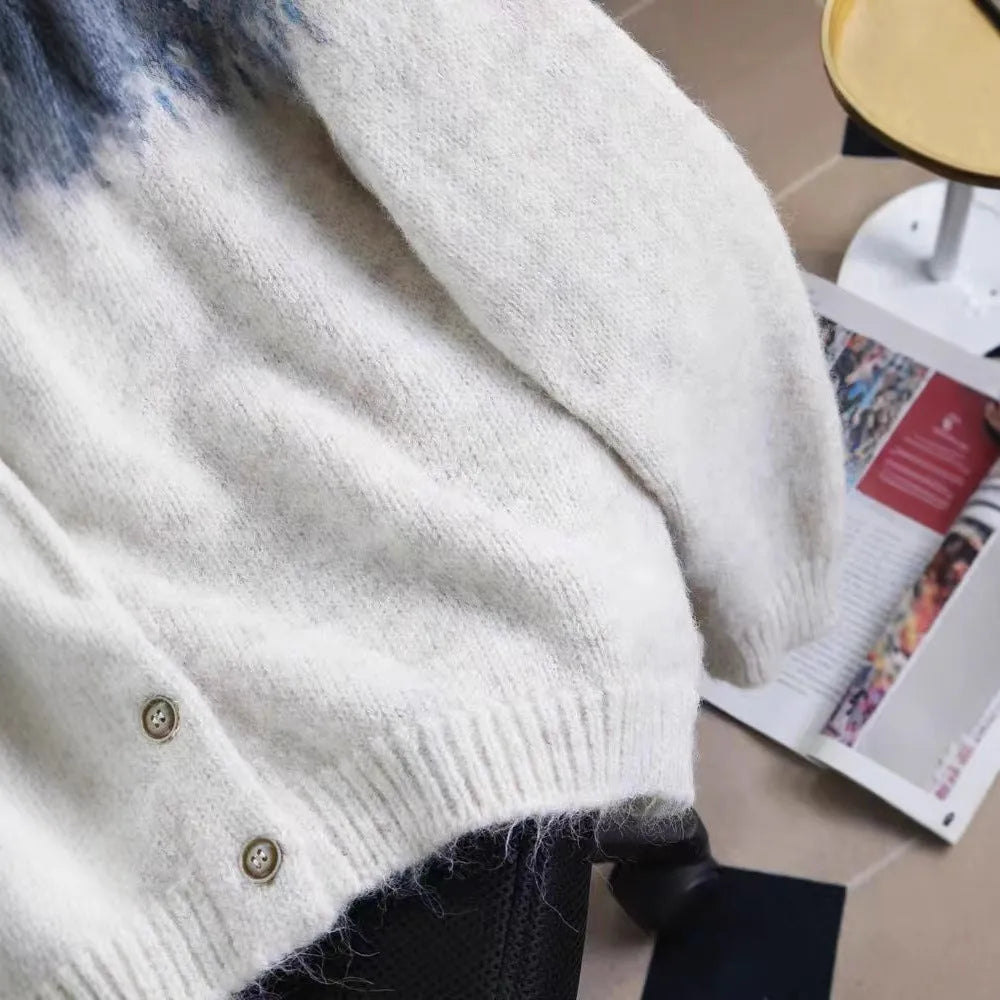 Women's loose fit jacquard knit sweater coat in milky white, shown on a hanger.