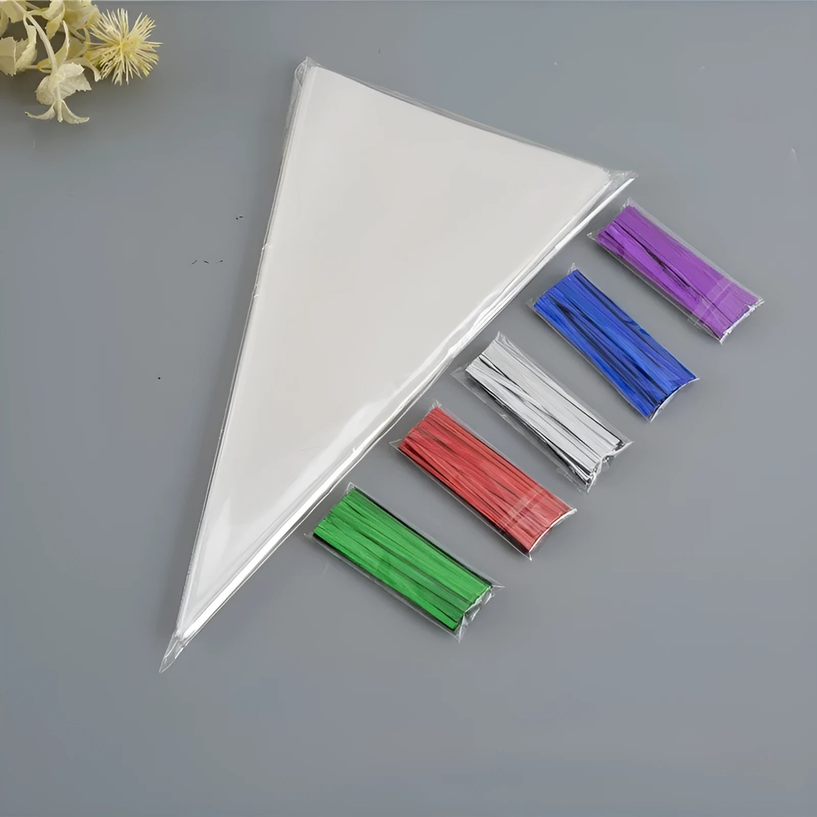 Clear triangle plastic packaging bag with twisted tie wire closure shown next to untied bag