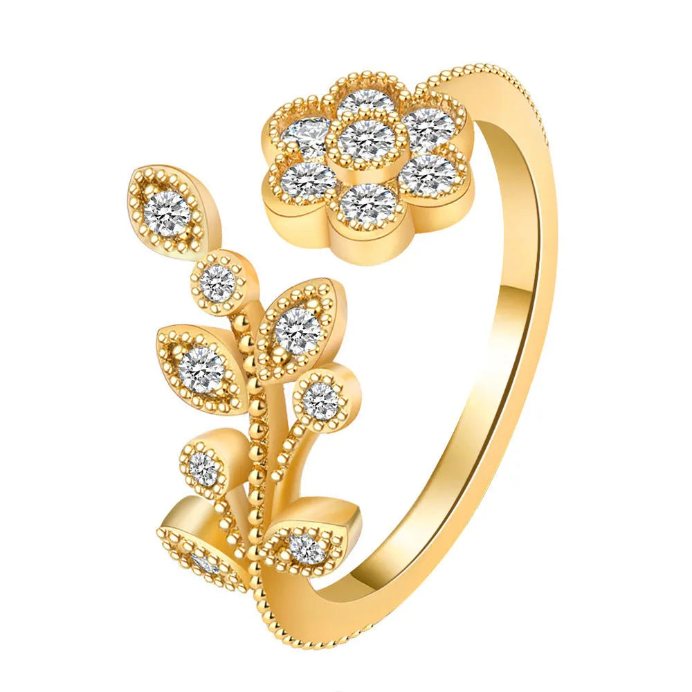 Copper open ring with diamond-treated floral and leaf decoration in gold colour