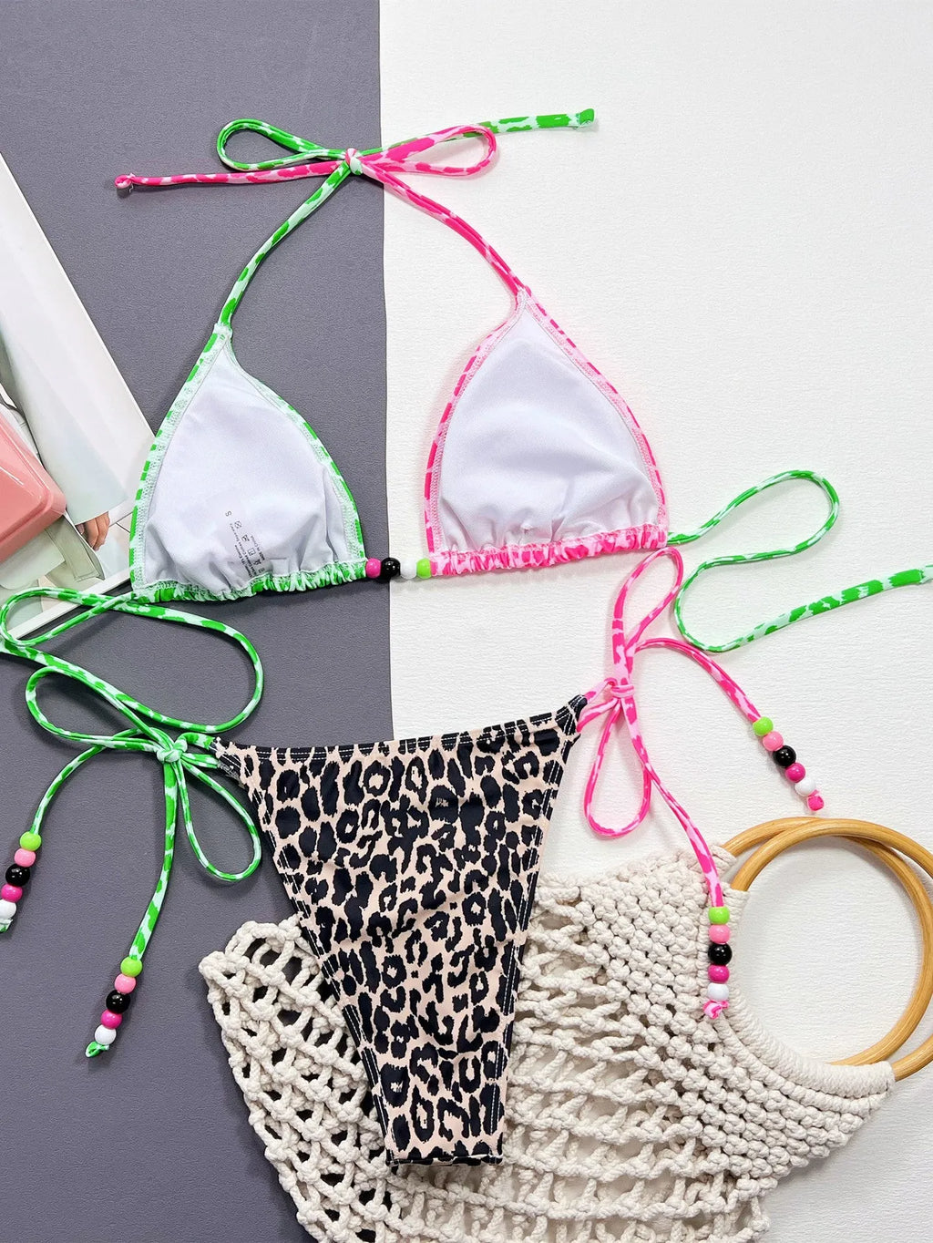 Women's leopard print bikini swimsuit with split briefs style showing bra and panties components