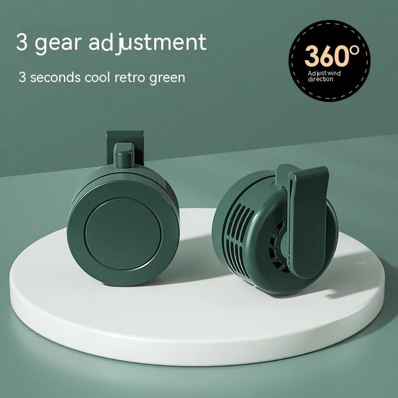 Green wrist hanging fan with USB power bank and light, showing three speed settings and compact design.