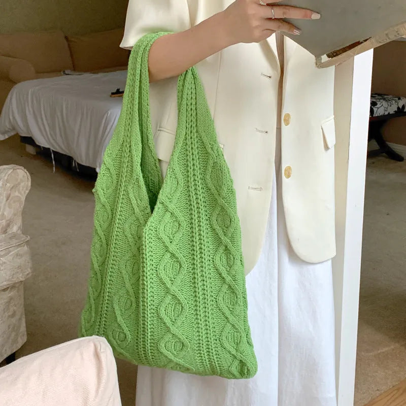 Women's retro hollow knitted woolen yarn shoulder tote bag in a solid colour with double straps.
