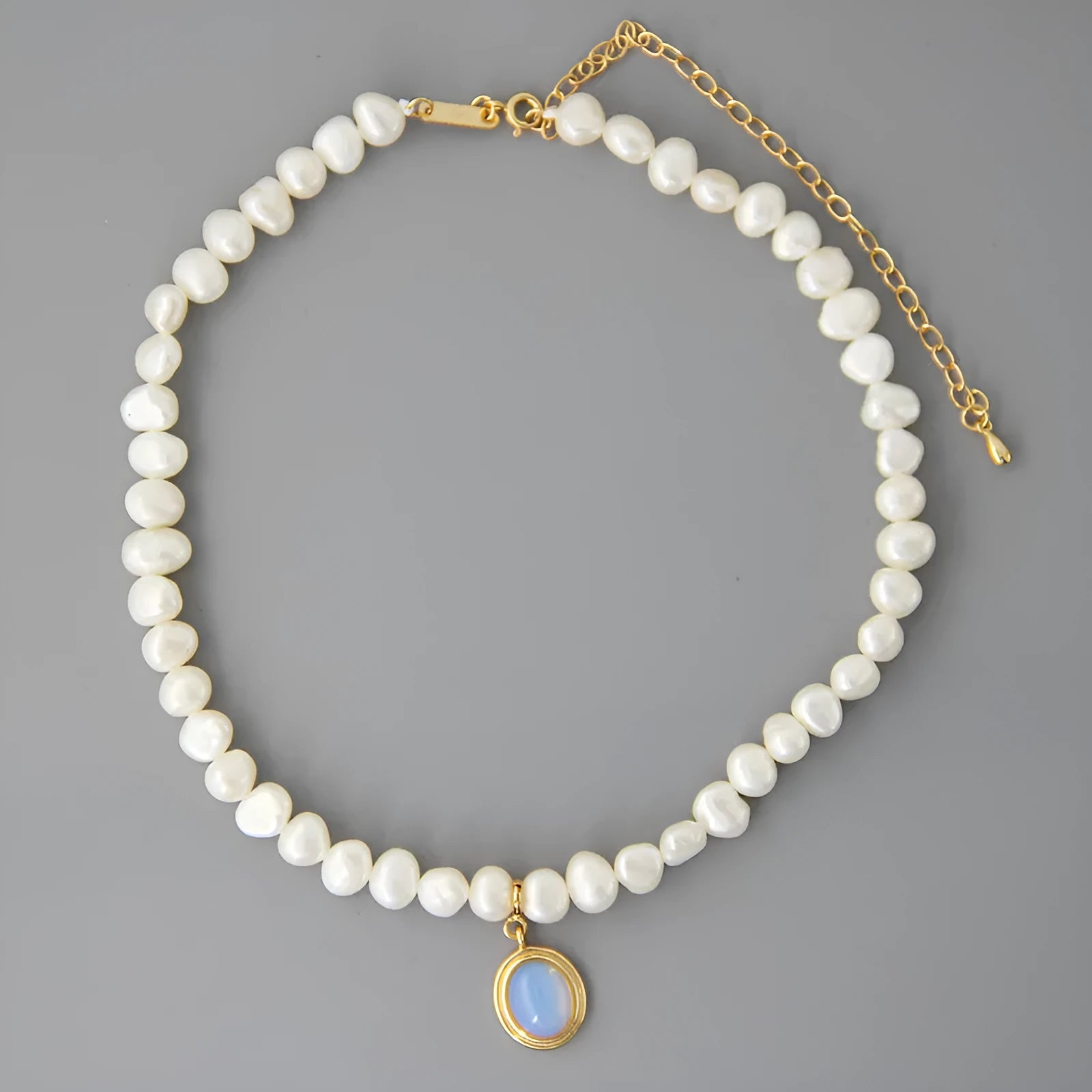 Geometric silver pendant pearl necklace with adjustable chain on white background