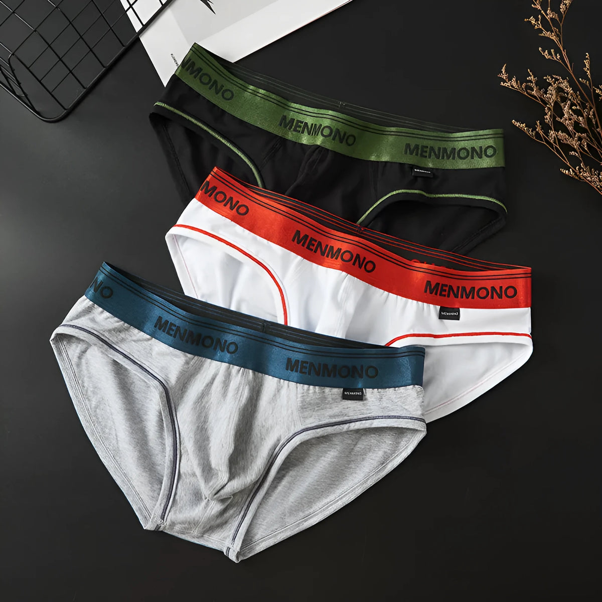 Men's low-waist cotton briefs in a solid two-tone colour on a white background.