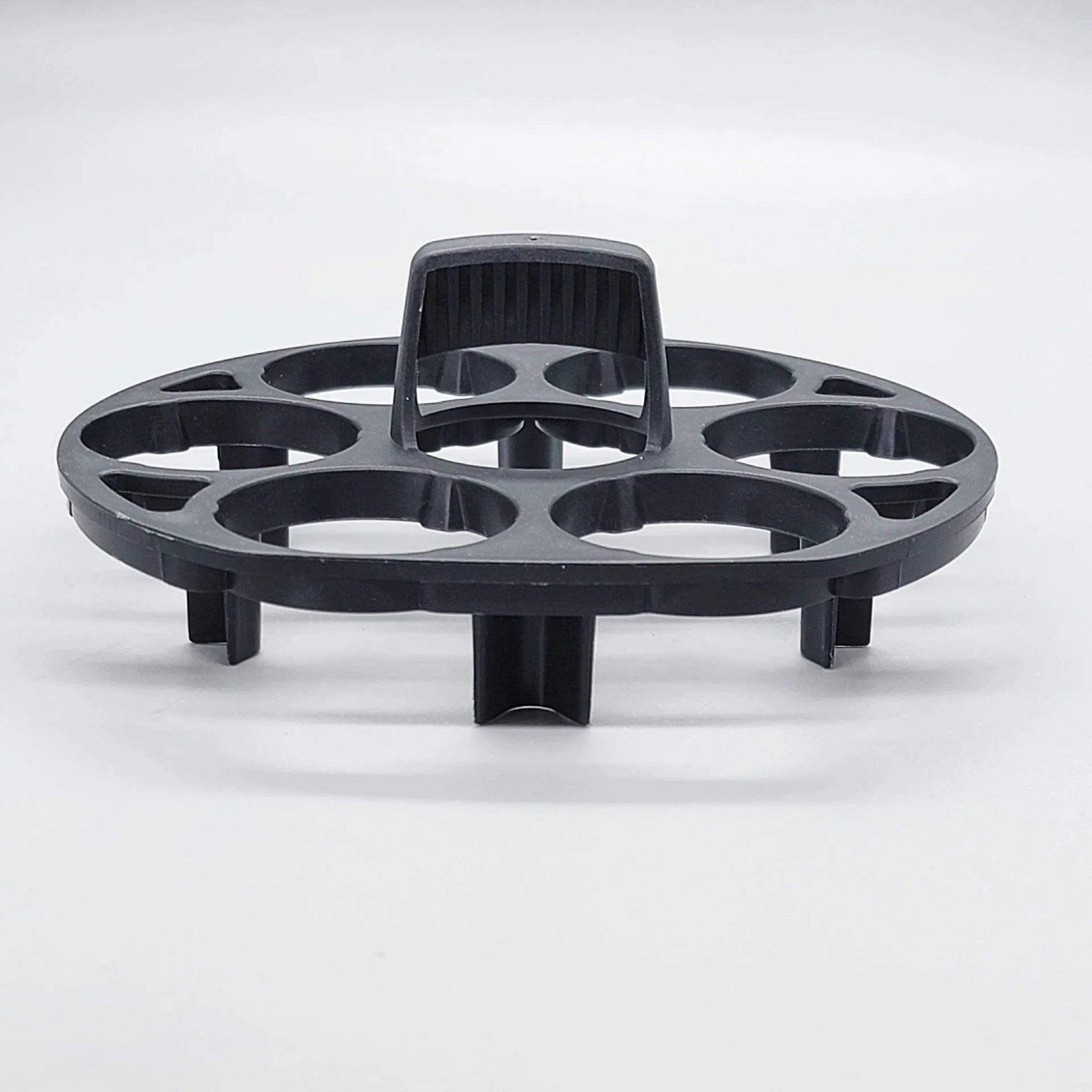 Black plastic egg holder for cooking machines measuring 13.8 by 12.6 by 5.7 cm