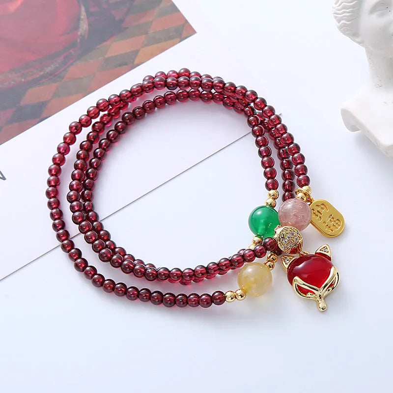 Purplish red garnet fox charm bracelet with adjustable rope closure for women