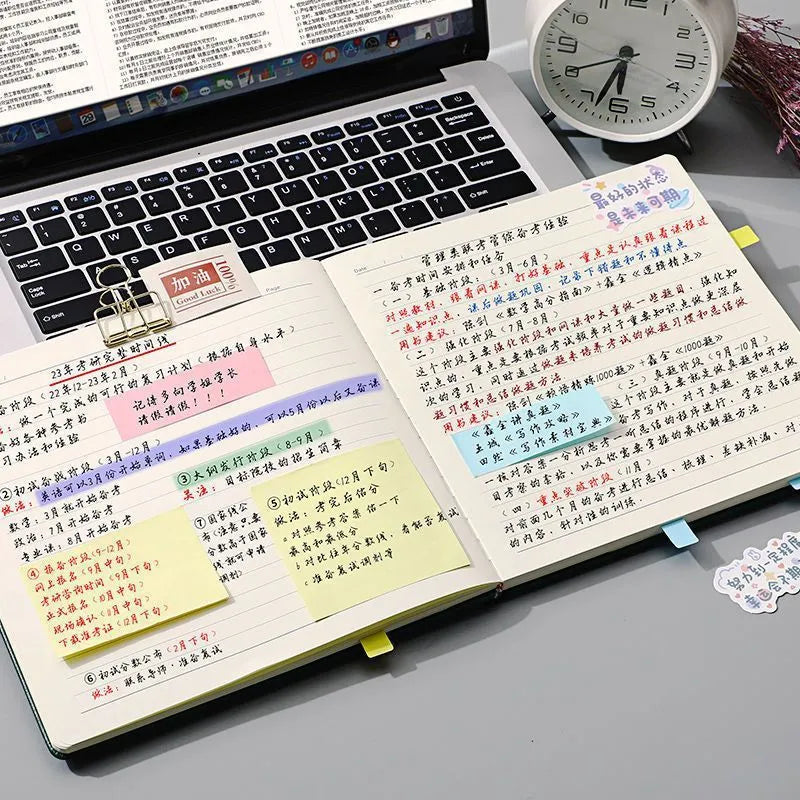 Square notebook with textured mesh leather cover showing colour options and open blank pages