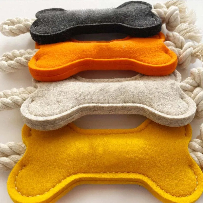 Bone-shaped dog toy with rope knots in four colour options showing dimensions of 16cm length
