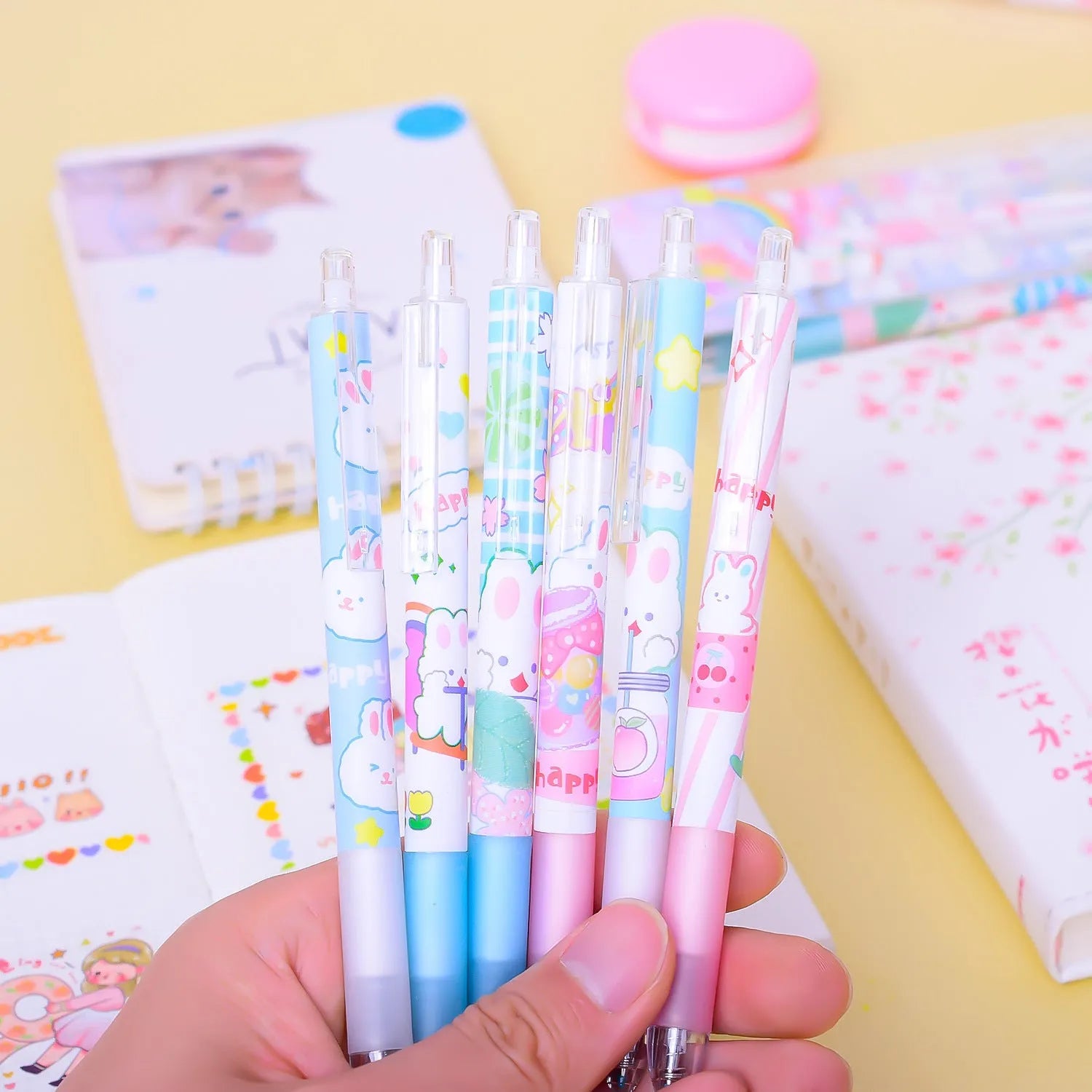 Six black pens with cartoon bunny designs and 0.5mm tips for student writing