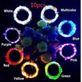 Flexible copper wire LED string lights wrapped around wine bottle with warm white illumination