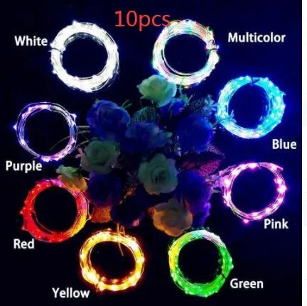 Flexible copper wire LED string lights wrapped around wine bottle with warm white illumination