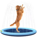 Anti-slip dog splash pad sprinkler toy on grass, showing textured PVC surface and hose connection.