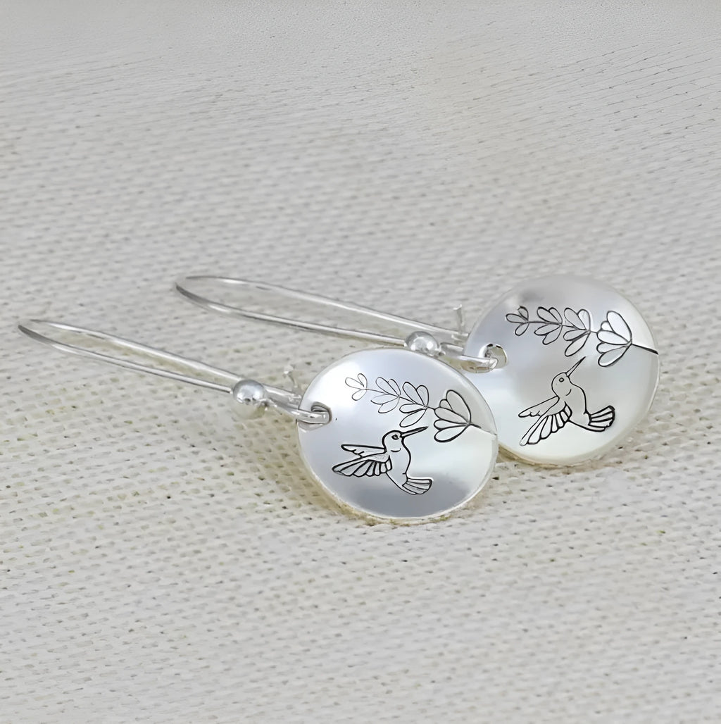 Silver circular earrings with bird and flower motifs in retro design
