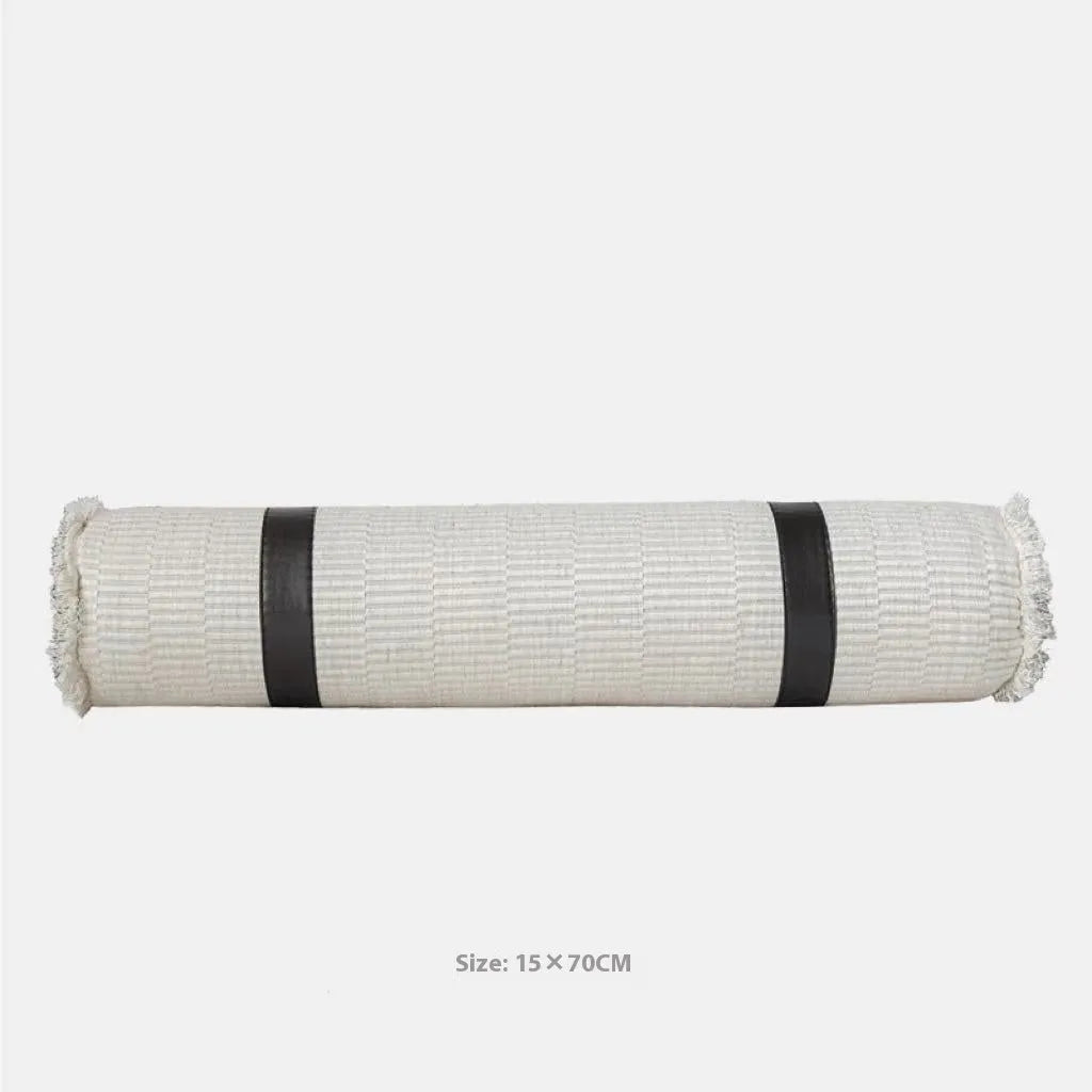 Modern minimalist grey and white plaid bed runner blanket with matching pillowcase and round leather pillow