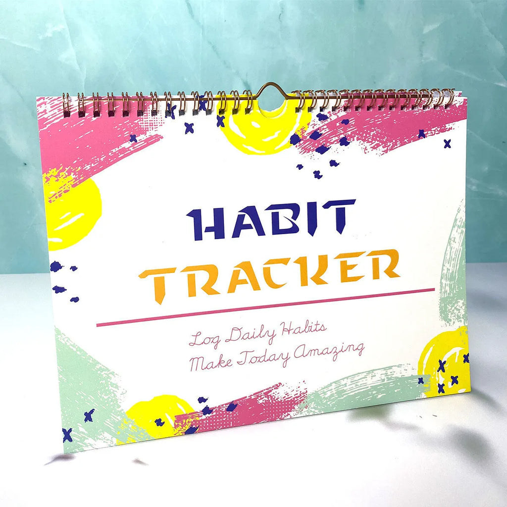 English habit tracking notebook with 12 pages in 21x28cm format showing four colour options